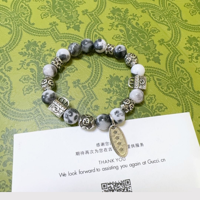 G*u*i bracelets